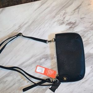 Women’s small purse, never used, comes with tags.